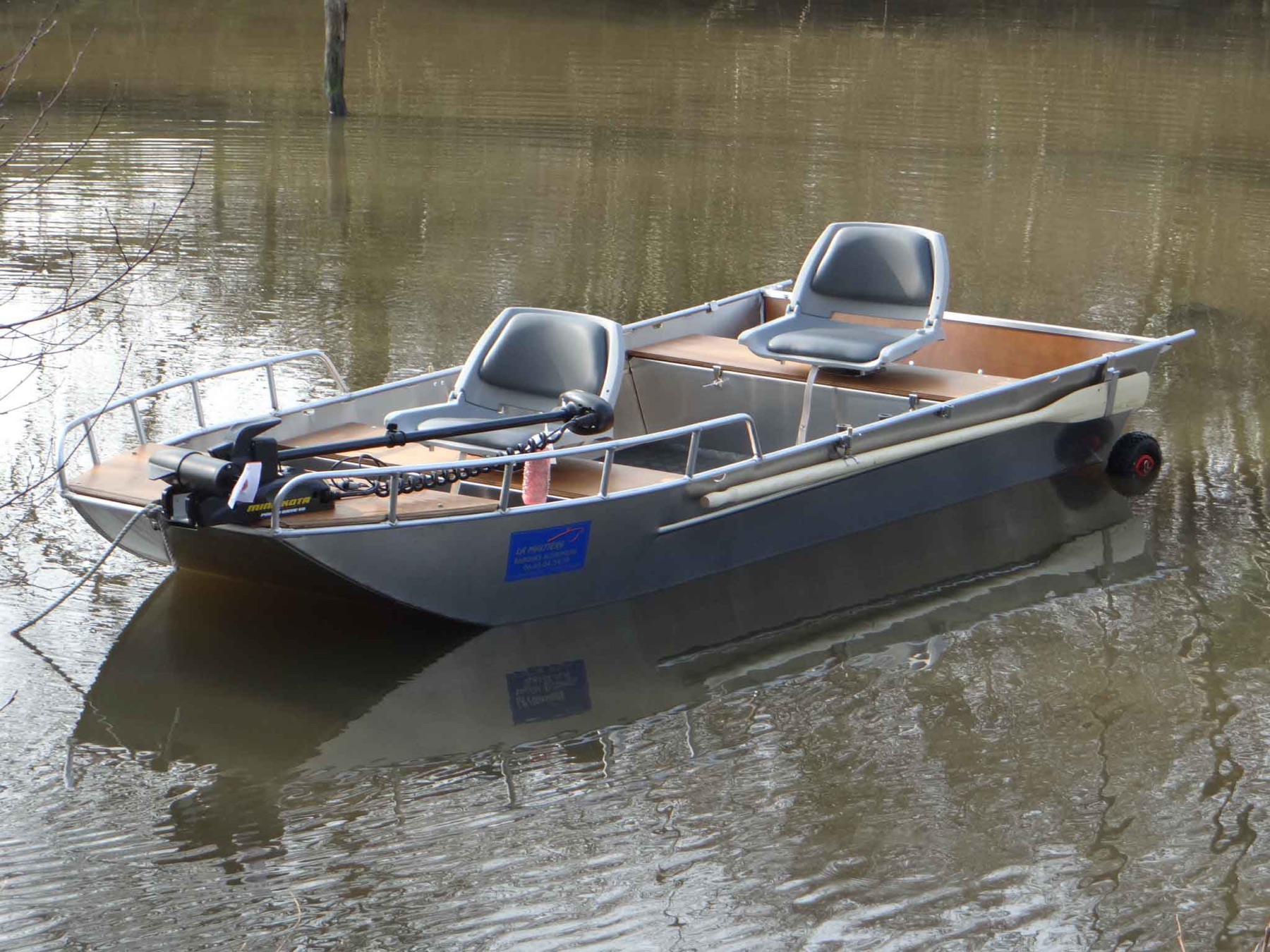 Small welded fishing boat on shore